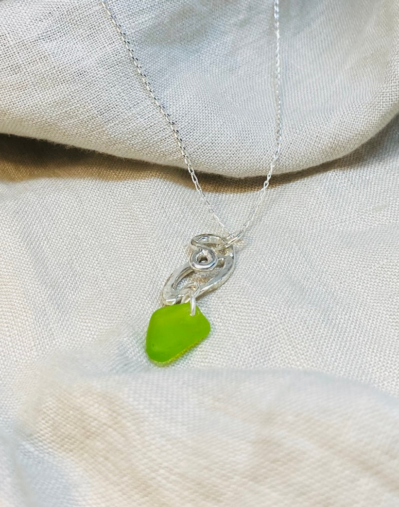 Necklace in Sterling Silver with Lime colour Sea Glass set on a Swirl Design